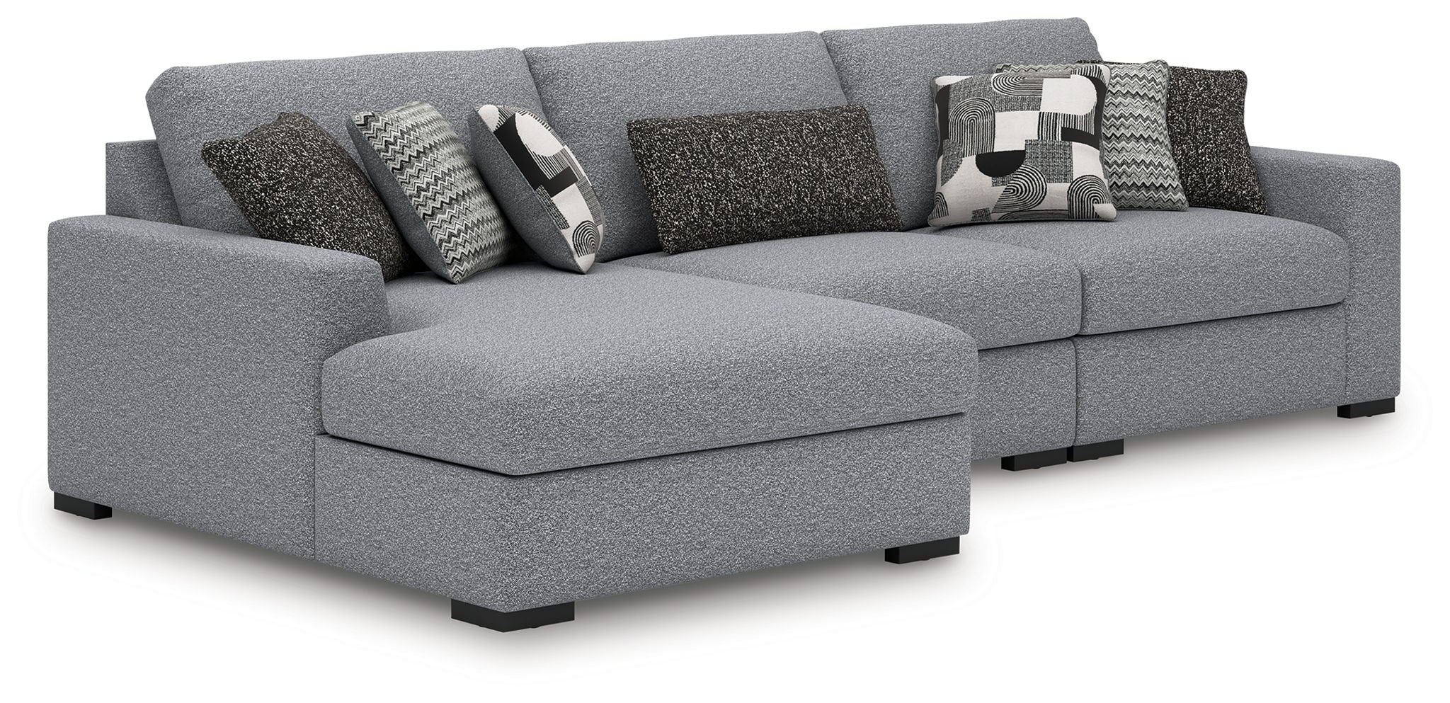 Gray fabric sectional sofa with chaise extension and patterned throw pillows