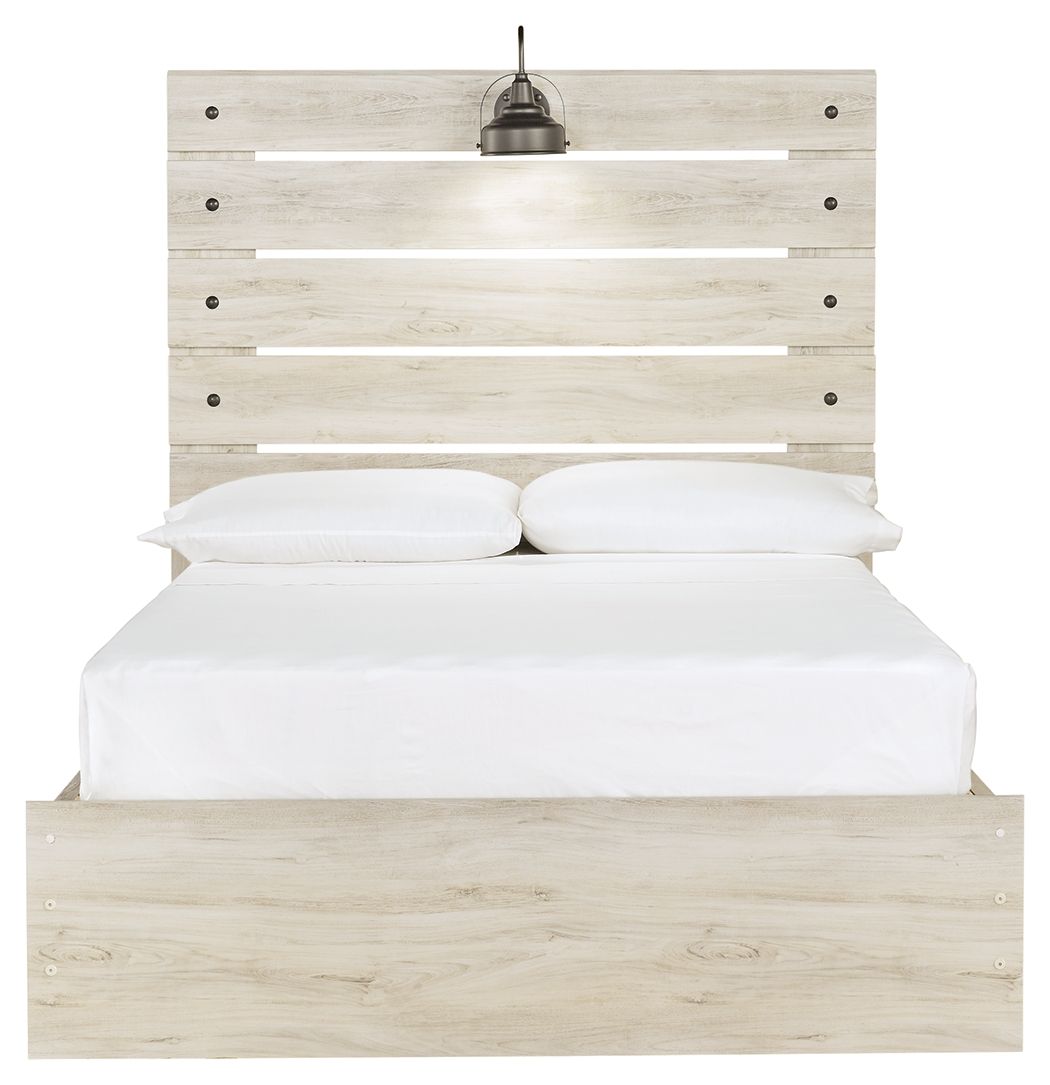 Cambeck panel bed with slatted headboard, beige wood, white pillows and mattress.