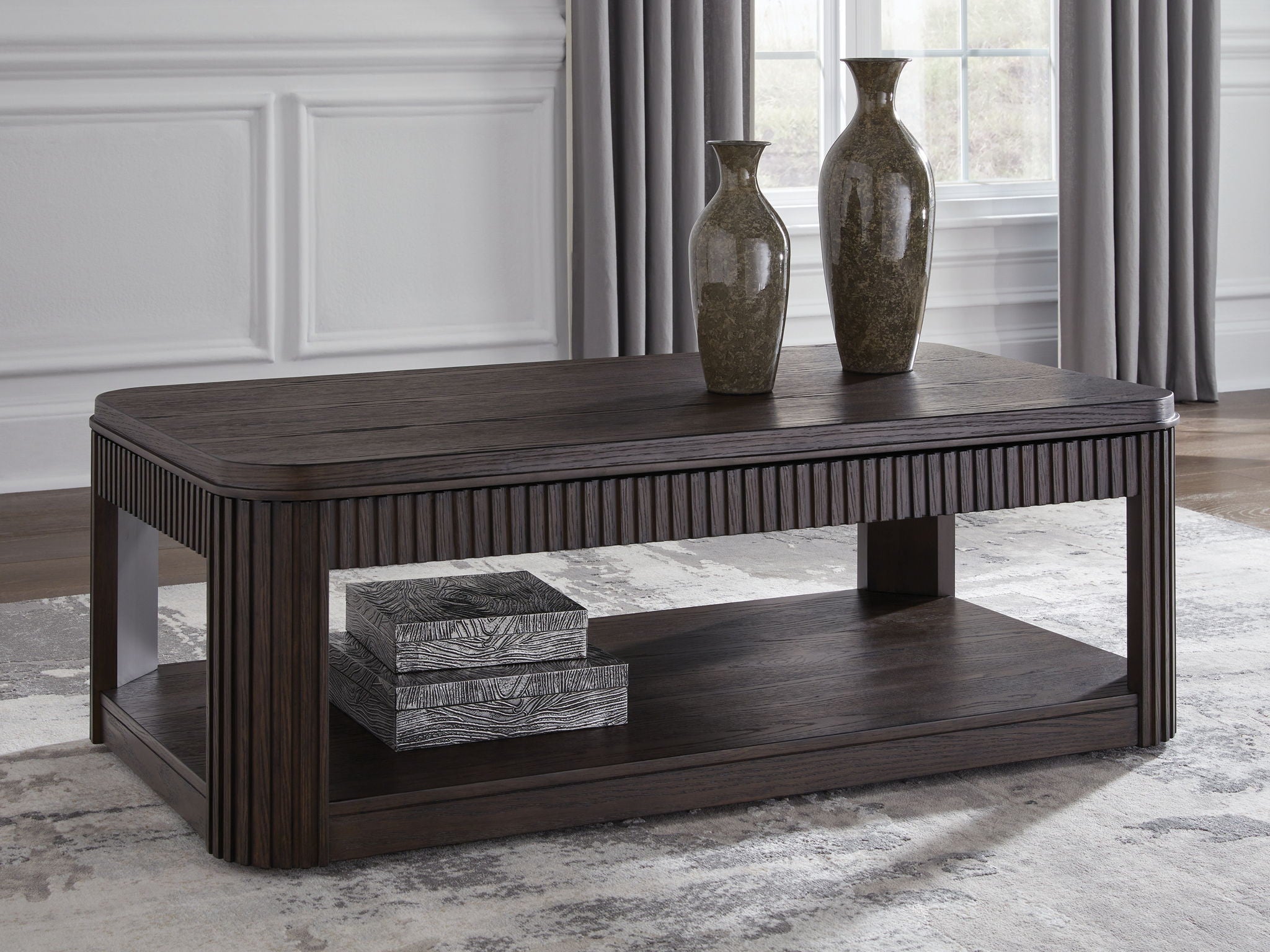 Dark brown rectangular coffee table with slatted sides and open lower shelf, wood-look finish.