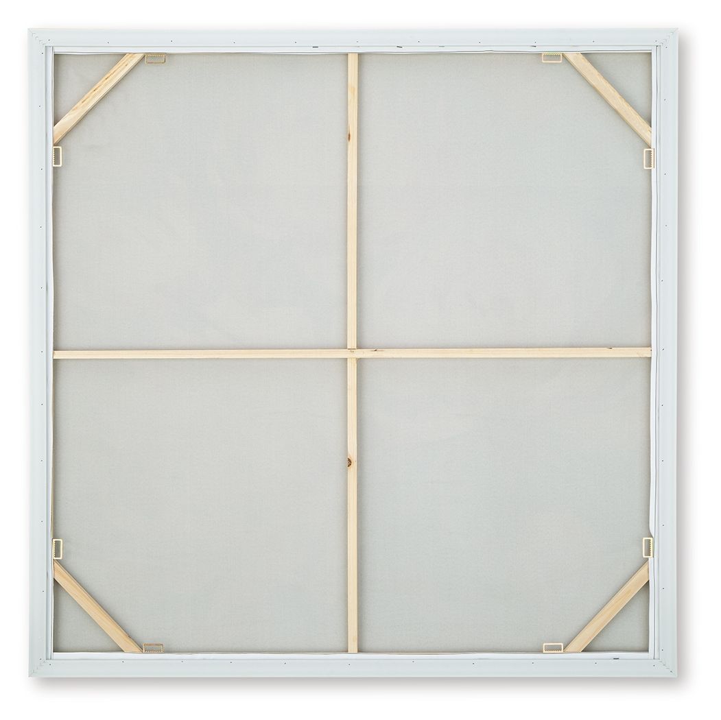 Back of framed wall art with white backing and wooden support braces