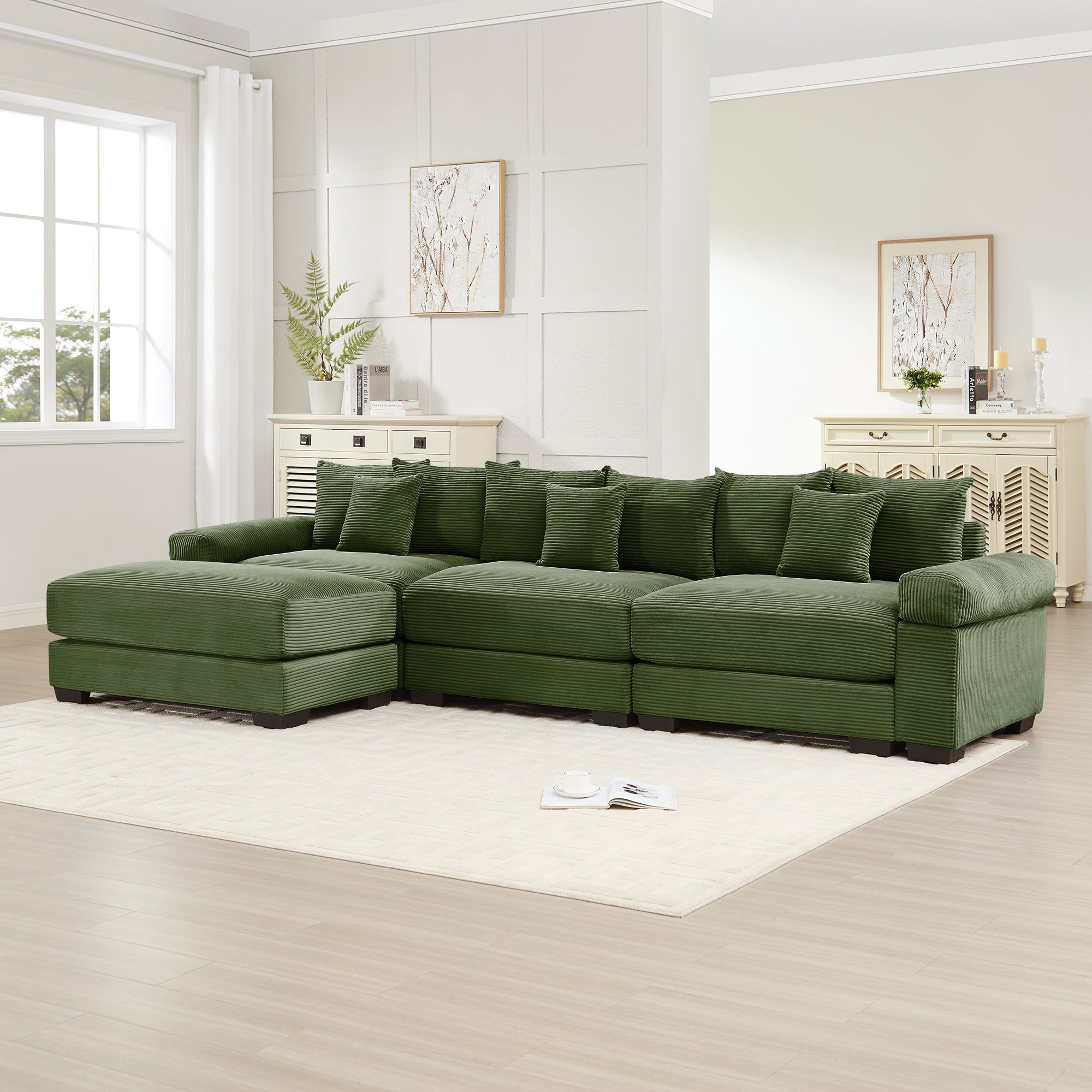 Green corduroy sectional sofa with modular ottoman corner and square armrests