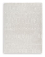 Light brown rug with geometric woven pattern