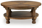 Round light brown wooden end table with round apron detail and lower shelf