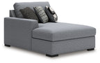 Grey fabric chaise section with armrest and ottoman-style seat