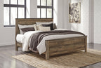 Panel bed with side drawers and neutral bedding with dark brown striped quilt and pillows