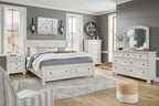 Antique white dresser with arched mirror and drawer storage, front view