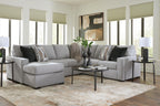 Light gray sectional sofa with chaise and dark striped throw pillows