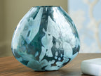 Blue glass vase with flared neck and rounded body, abstract drip-like pattern