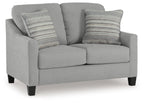 Gray loveseat with two seat cushions and four striped accent pillows
