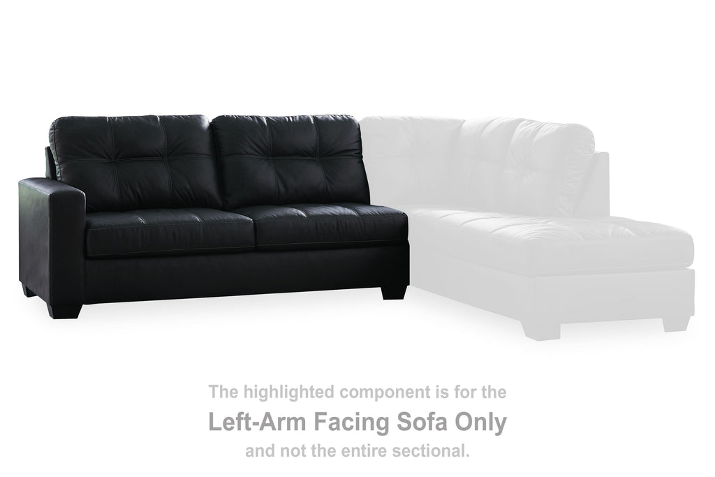 Left-arm facing dark sofa section with tufted back and padded seat