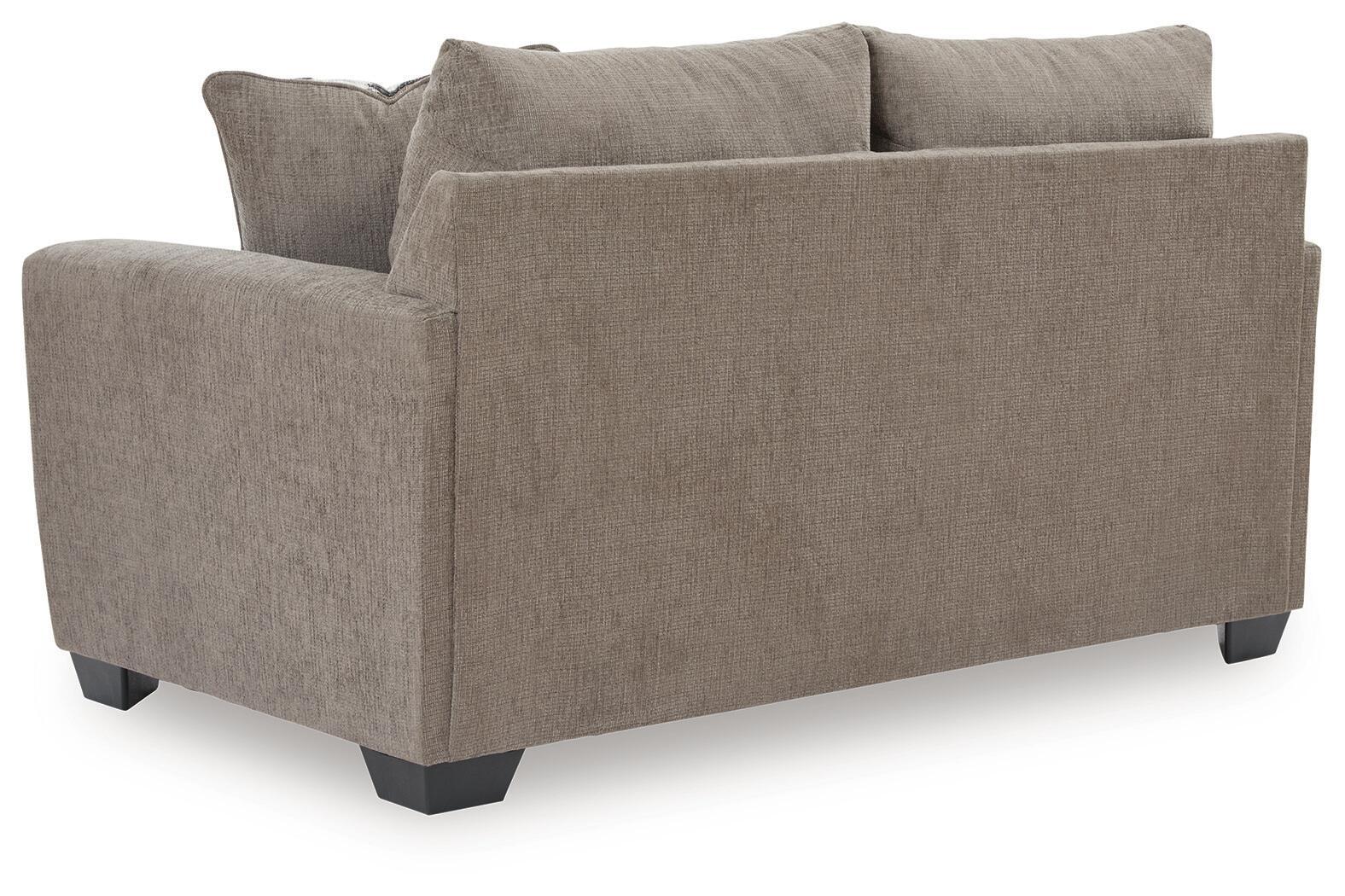 Light brown loveseat with two back cushions, no throw pillows