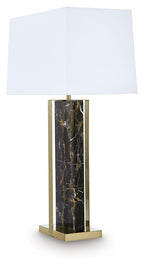 Black marble table lamp with gold base supports and white fabric shade
