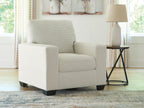 Upholstered armchair with striped upholstery, thick seat cushion, and dark block legs in white.
