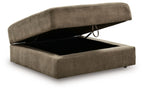 Fabric storage ottoman with open lid, revealing a dark interior compartment