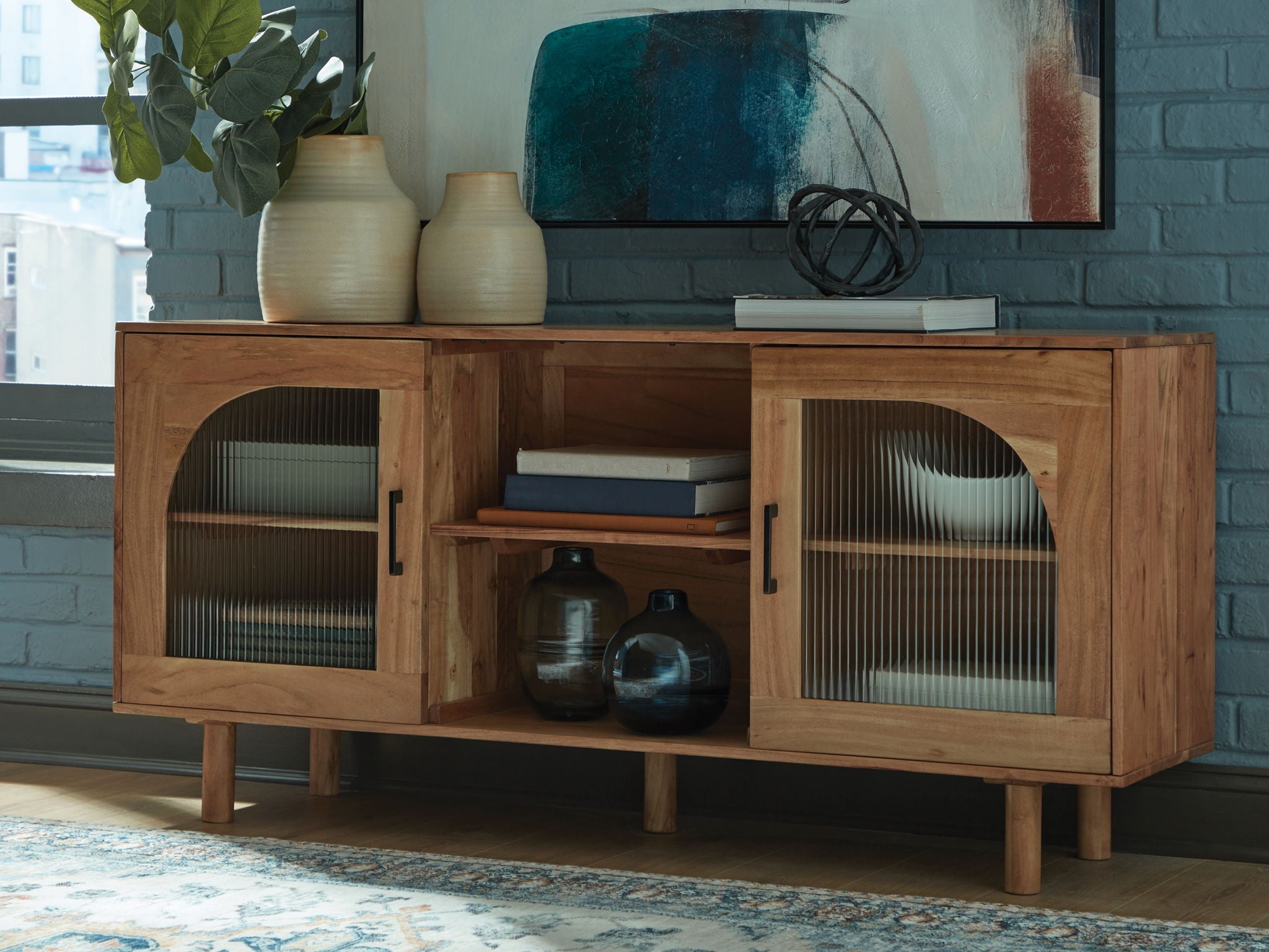 Natural brown accent cabinet with two doors featuring arched ribbed glass panels