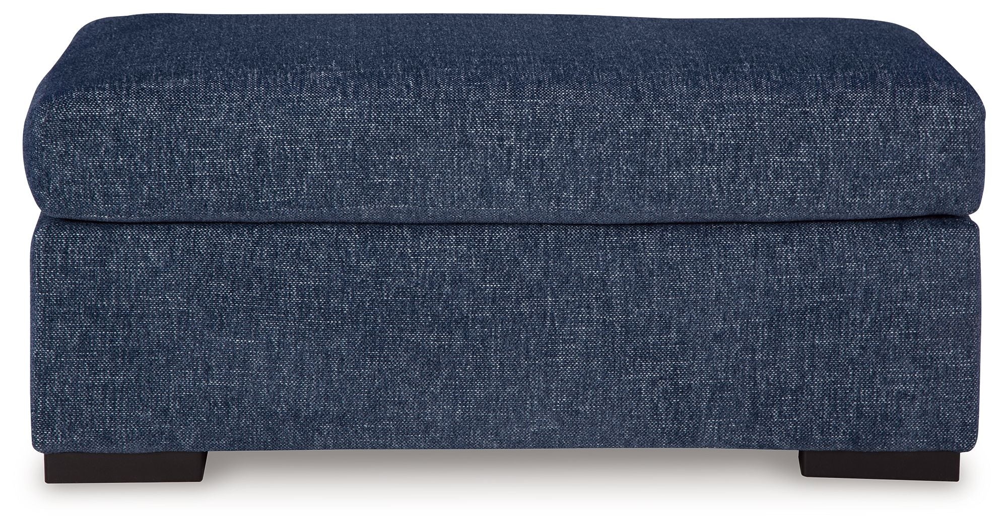 Dark blue upholstered ottoman with cushioned top and square frame