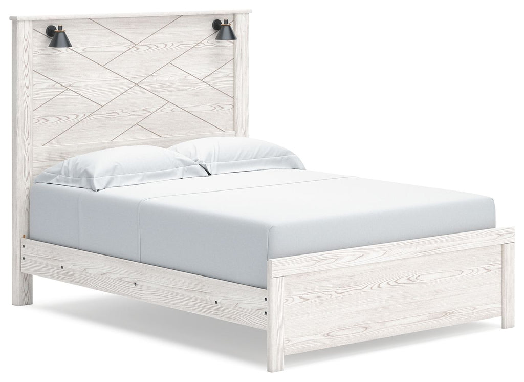 White panel bed with two black wall sconces and slatted headboard, light wood grain