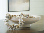 Antique beige ceramic bowl with decorative dried branches and flowers on rim