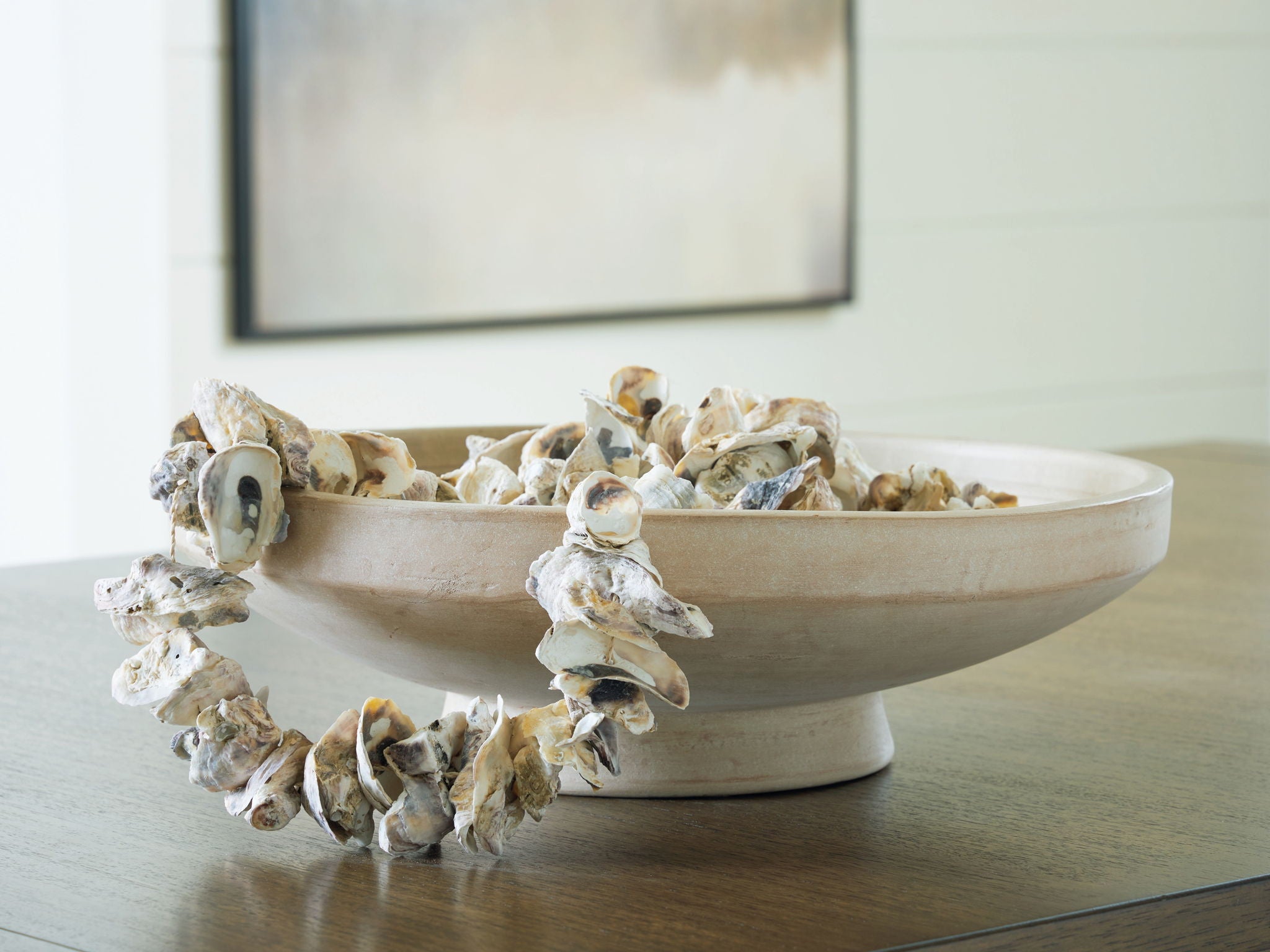 Antique beige ceramic bowl with decorative dried branches and flowers on rim