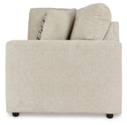 Pearl silver upholstered sofa with curved arms and patterned throw pillow