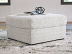Light gray oversized accent ottoman with rounded top and black base feet