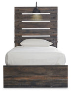 Panel bed with slatted headboard, dark wood base and white bedding