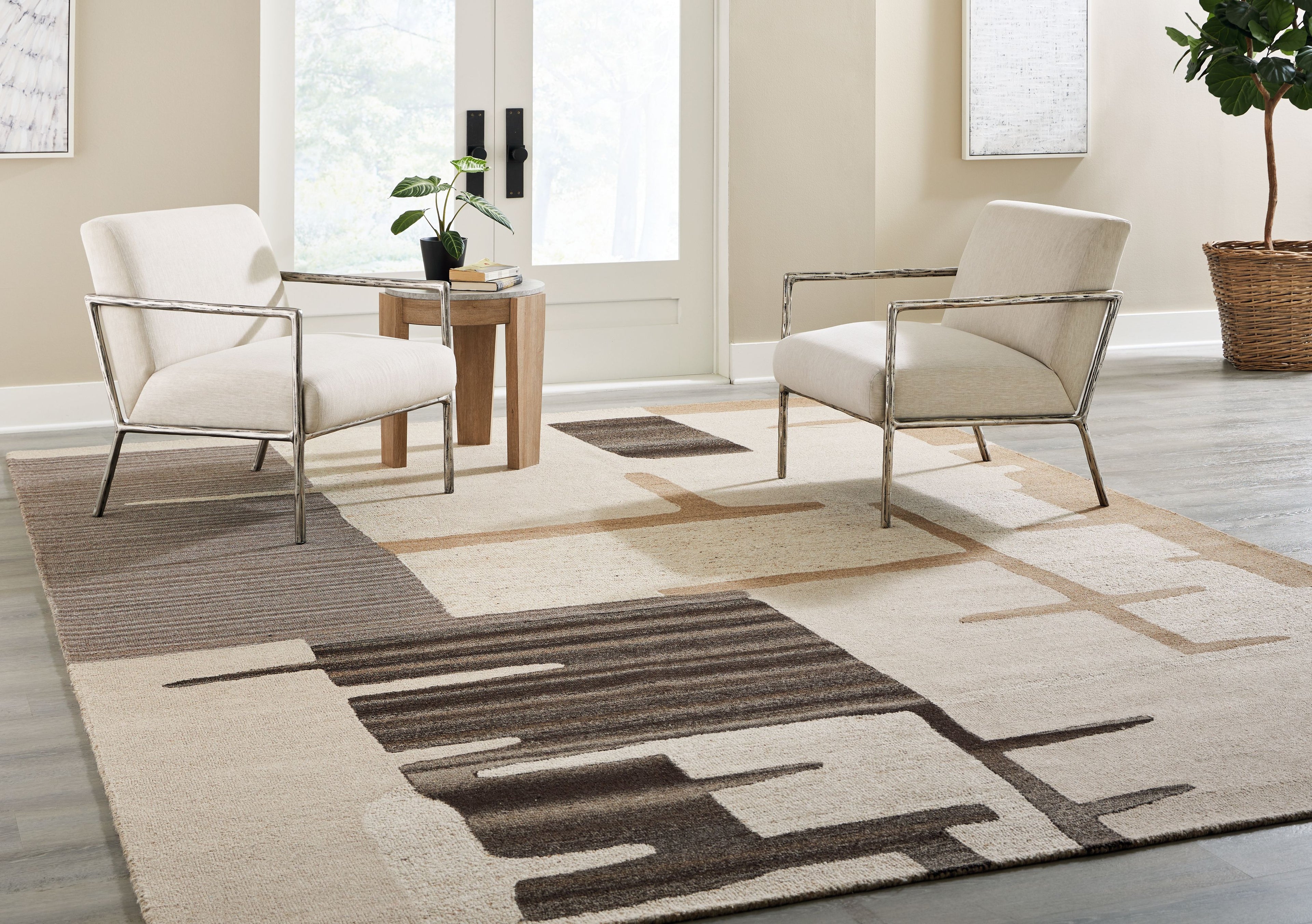 Abstract beige area rug with dark brown block pattern and light border bands