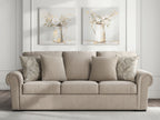 Heather fabric sofa in light beige with four pillows, wide seat, rounded arms and back