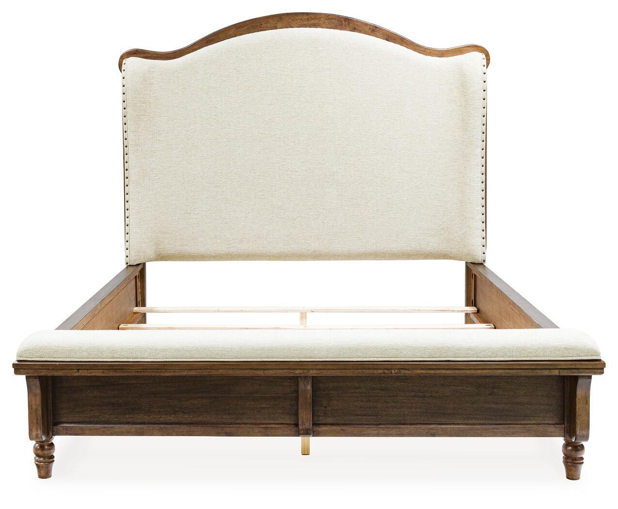 Upholstered panel bed with cream upholstered headboard, dark brown wood posts and slats