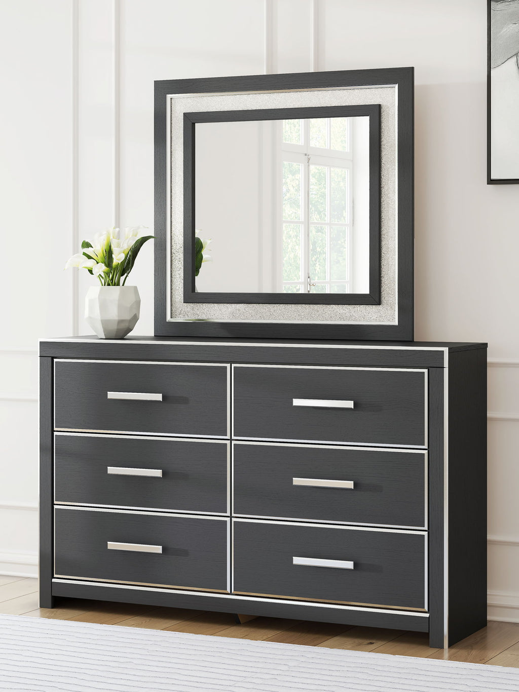 Black dresser with six drawers and square framed mirror, front view