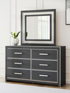 Black dresser with six drawers and square framed mirror, front view