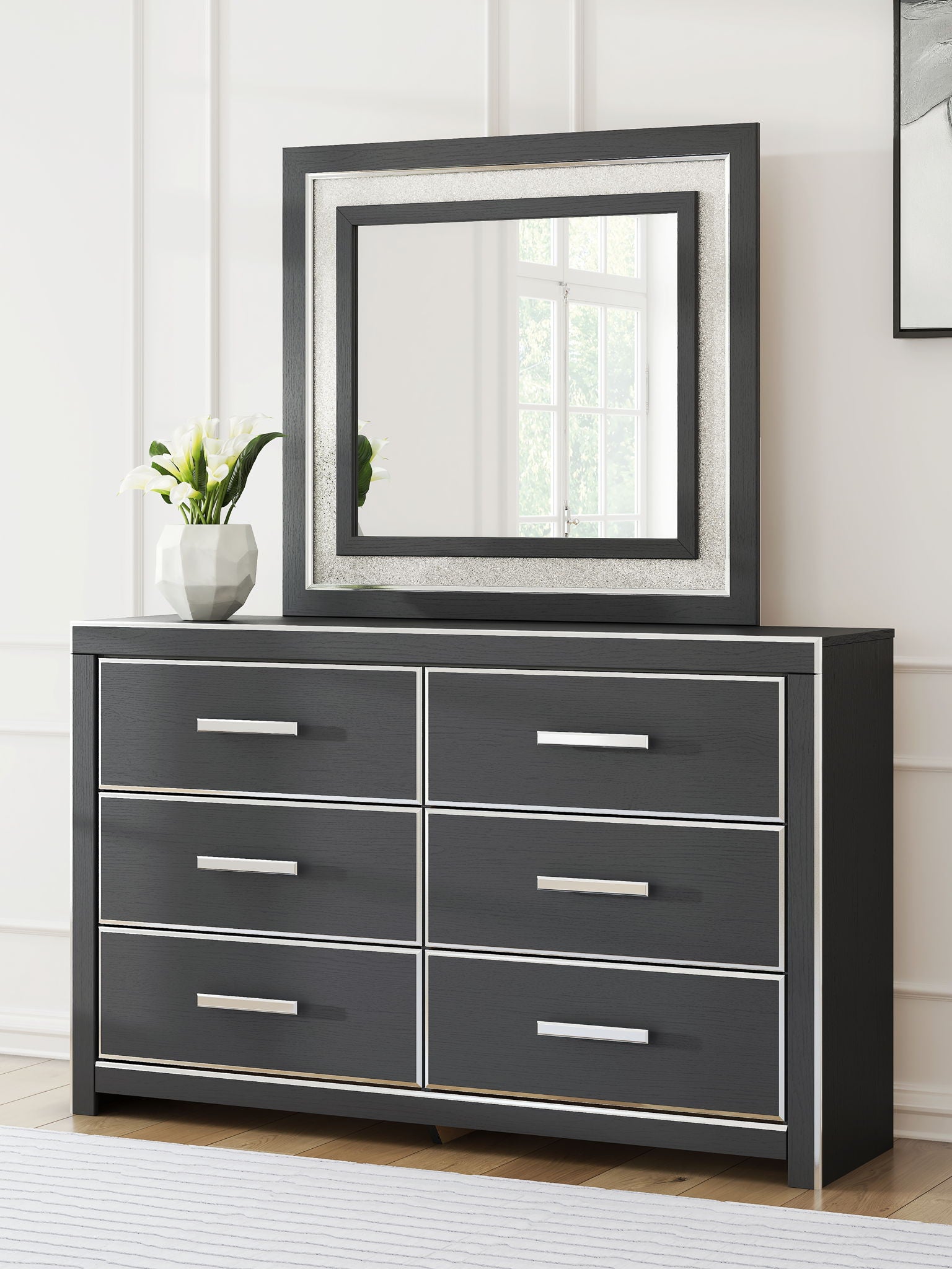 Black dresser with six drawers and square framed mirror, front view