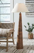 Wood floor lamp with cream fabric shade and dark brown stacked-ring wooden base