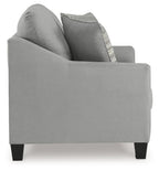 Gray loveseat with curved arms and a striped accent pillow on the backrest