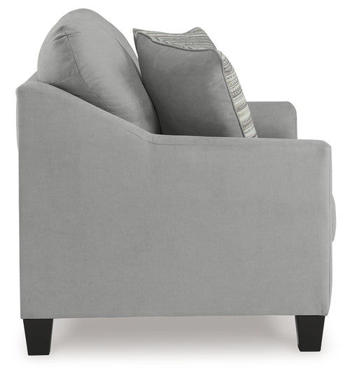 Gray loveseat with curved arms and a striped accent pillow on the backrest