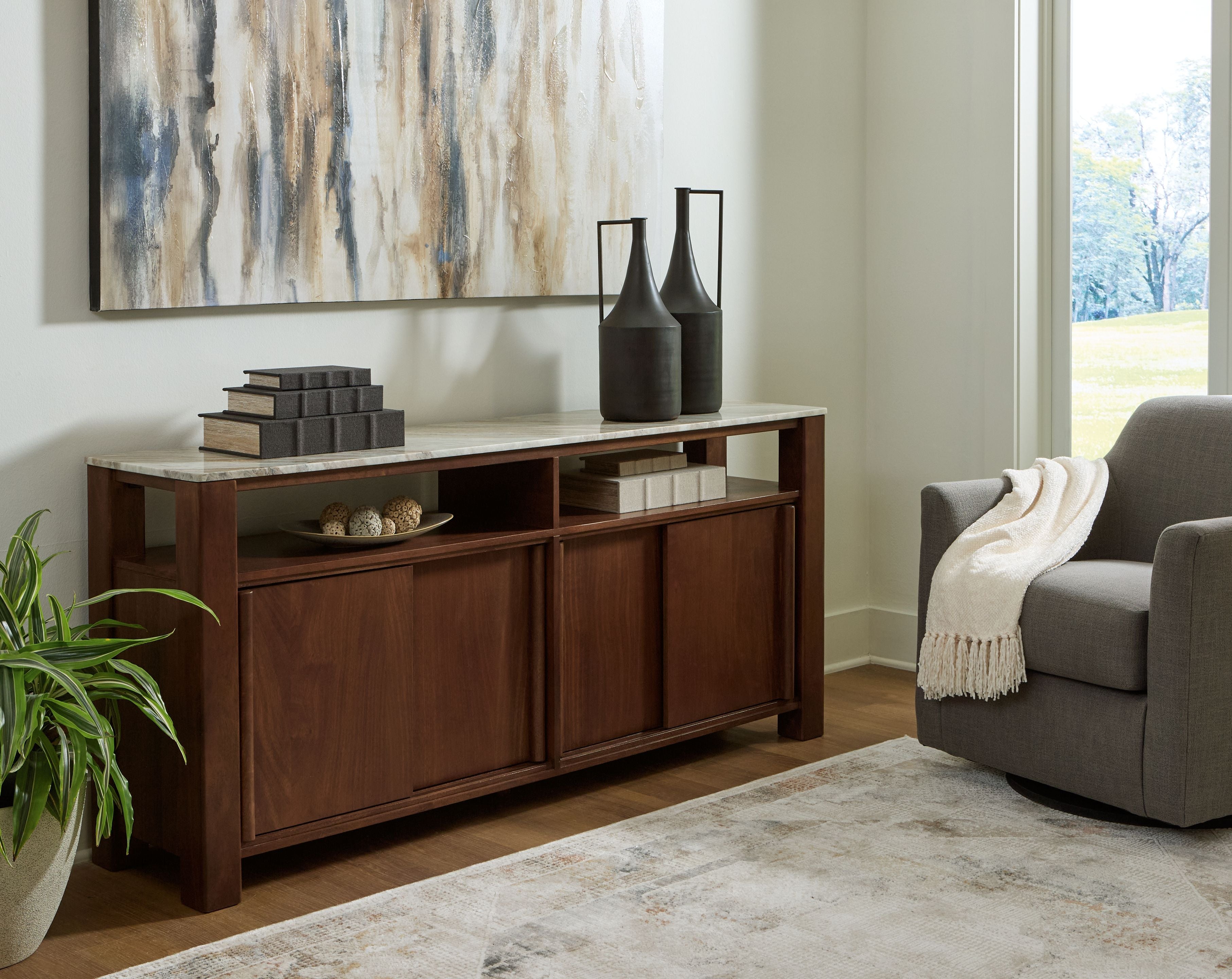 Tobinville dark brown accent cabinet with two doors and open center shelf