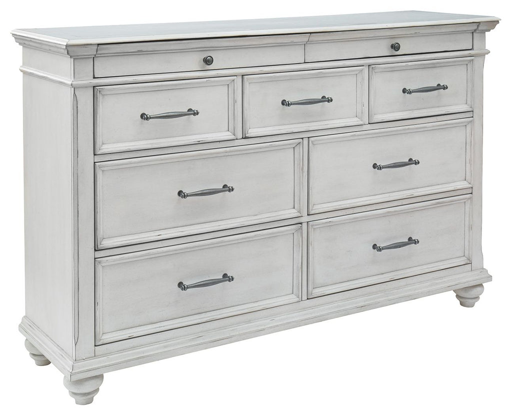 Whitewash dresser with six drawers, metal bar pulls, and turned legs