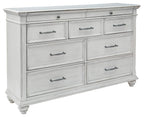 Whitewash dresser with six drawers, metal bar pulls, and turned legs
