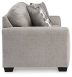 Gray flannel sofa with side arm, two back pillows, and geometric throw