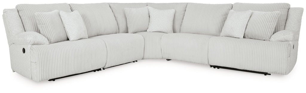 Light gray reclining sectional sofa with cushioned arms and back pillows