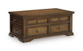 Dark brown wooden cocktail table with 4 drawers and brass-tone knobs
