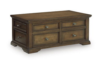 Dark brown wooden cocktail table with 4 drawers and brass-tone knobs