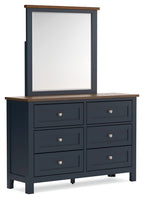 Dark blue dresser with mirror, brown top, six drawers, silver knobs