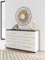 Six-drawer dresser in white with warm wood top and gold bar drawer pulls.