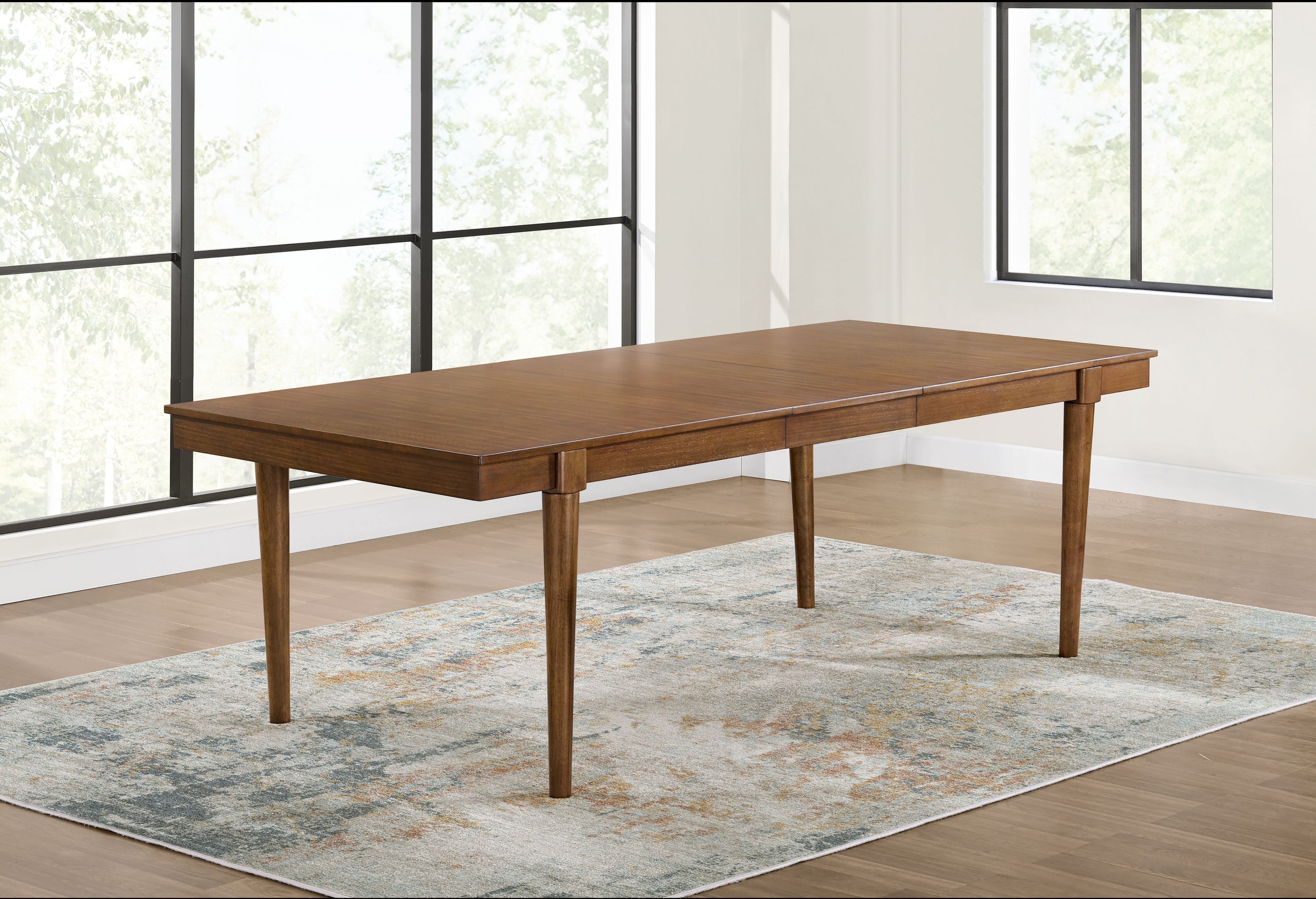 Brown rectangular extension dining room table with smooth wood top and tapered legs