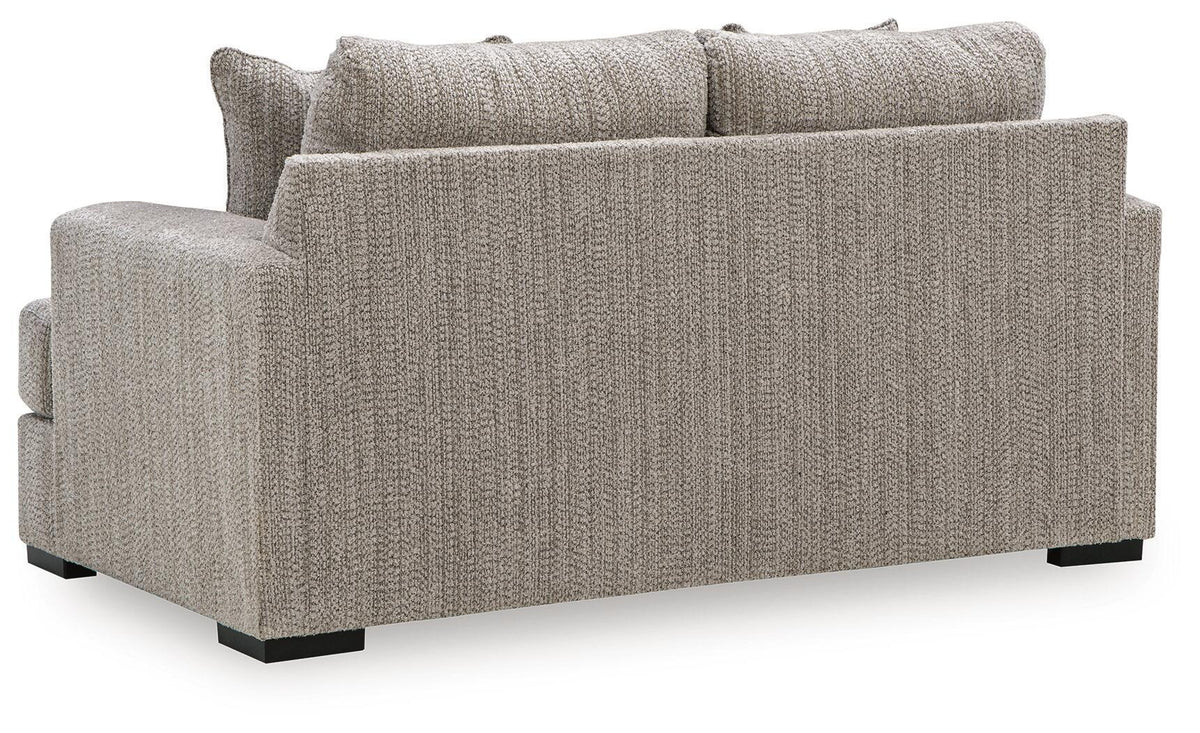 Light gray upholstered loveseat with square arms and thick seat cushion