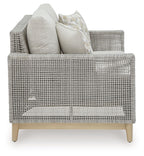 Gray woven loveseat with back cushions, two seat cushions, and two patterned pillows