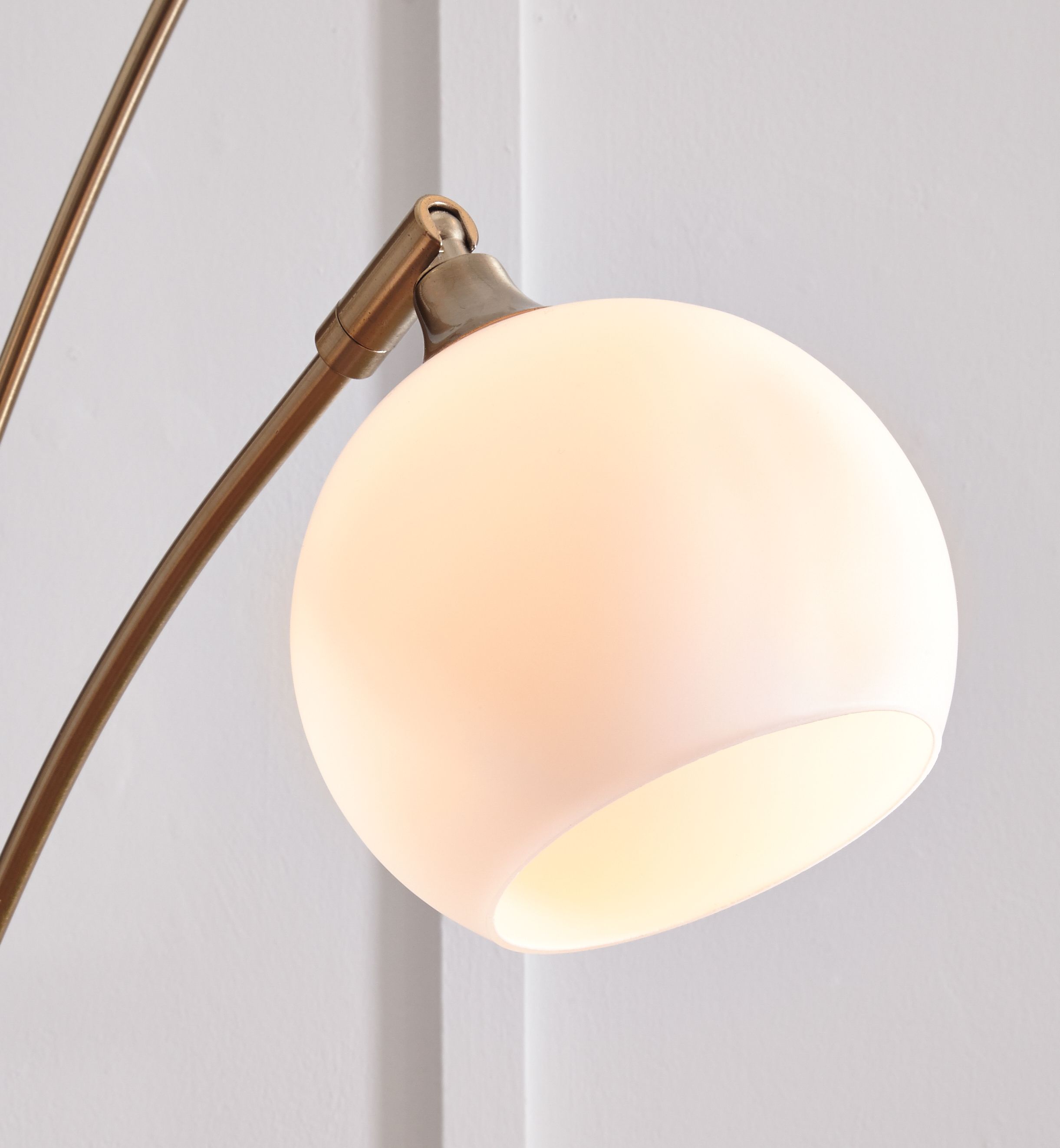 Champagne metal arc lamp with white globe shades