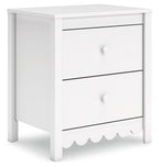 White two-drawer nightstand with scalloped drawer front and round knobs