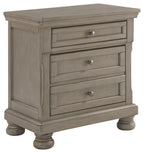 Lettner night stand with three drawers and round bun feet, light gray finish.
